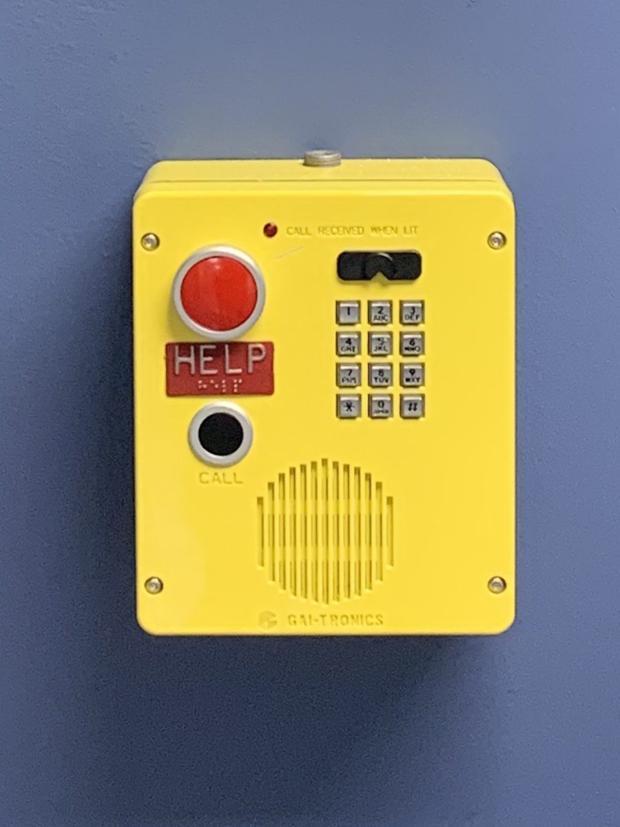 Yellow emergency callboxes on floors of campus buildings.