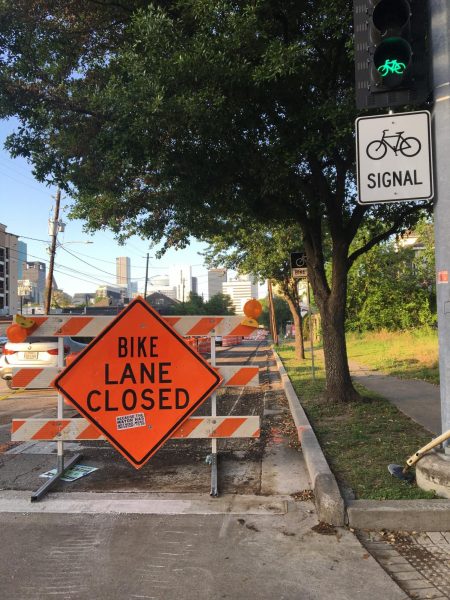 Sticker pasted on "Bike Lane Closed" sign by unknown protestor that says "Because the mayor has nothing more important to do."