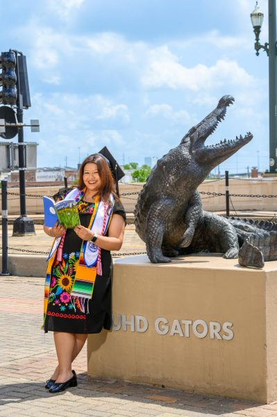 Carrillo holds the spring 2025 issue of The Bayou Review as she prepares for graduation. Courtesy: Karla Carrillo