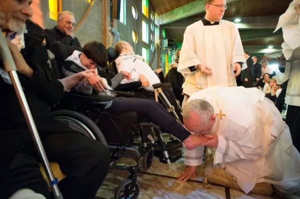 Pope Francis kissing a disabled woman's feet. Courtesy: NBC News