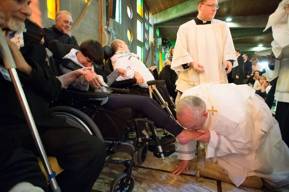 Pope Francis kissing a disabled woman's feet. Courtesy: NBC News